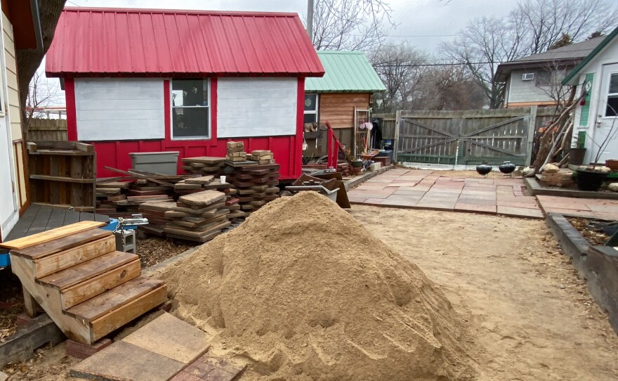 Part of an Occupy Madison tiny home village in Madison, Wisconsin, was under construction in December, 2021. The community also has a woodworking shop where it makes items to sell to support itself, including birdhouses that resemble the tiny houses.