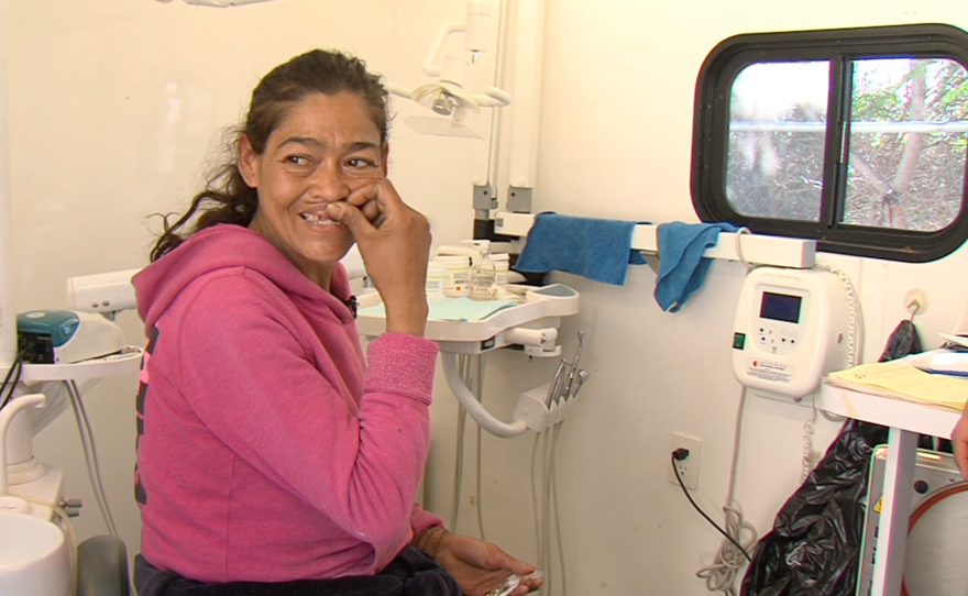 Venus Saiza Cruz receives dental treatment at a mobile medical hospital at a Tijuana rehabilitation center, March 30, 2015.