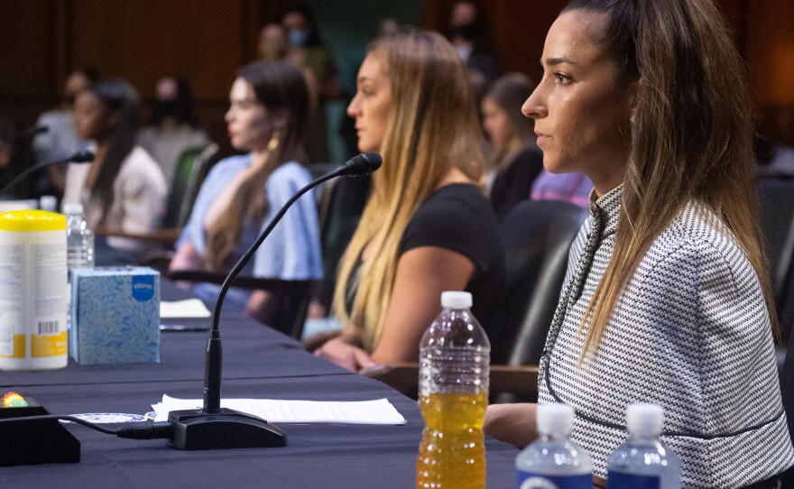 (L-R) U.S. Olympic gymnasts Simone Biles, McKayla Maroney, gymnast Maggie Nichols, and U.S. Olympic gymnast Aly Raisman, testify during a Senate hearing about the Inspector General's report on the FBI handling of the Larry Nassar investigation of sexual abuse of Olympic gymnasts, on Capitol Hill, September 15, 2021, in Washington, DC.