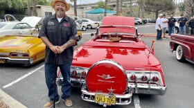 Marcos "Mr. Rabbit" Arellano stands with his 1962 Chevy Impala convertible lowrider car on the campus of City College, Thursday, San Diego, Calif., September 29, 2022.