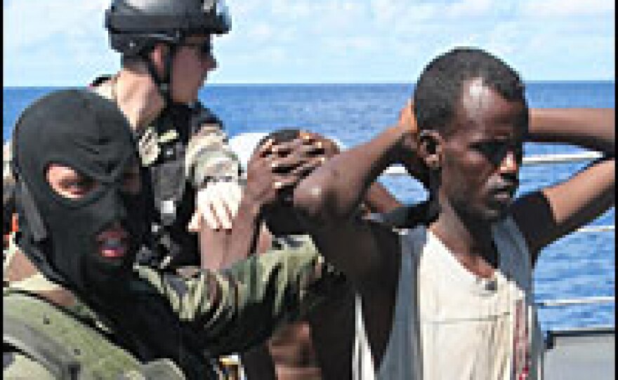 French soldiers guard suspected Somali pirates onboard the French warship Le Nivose, after the pirates' capture Sunday as part of the EU's Atalante anti-piracy naval mission.