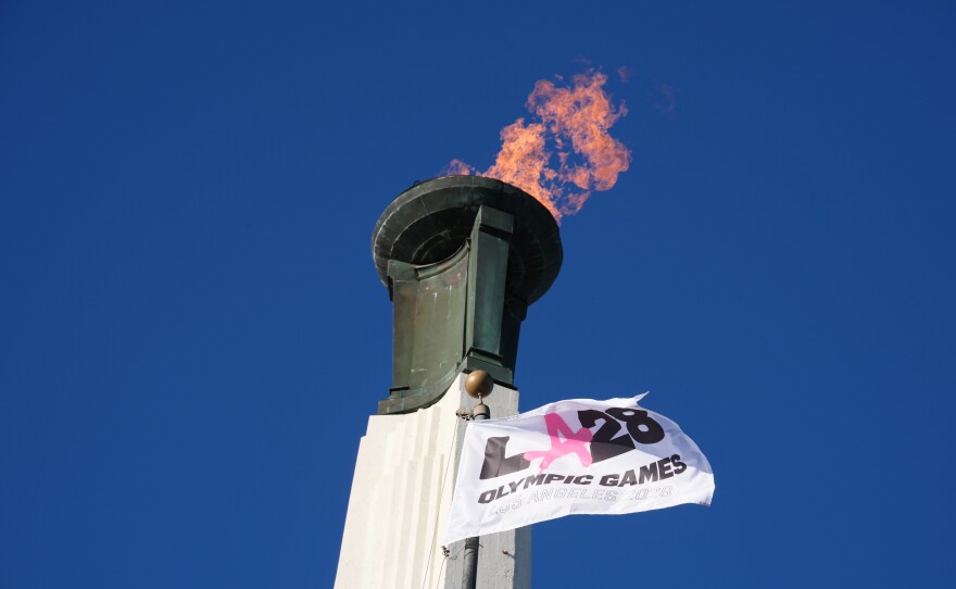 The Olympic cauldron is lit at the Los Angeles Memorial Coliseum in January ahead of ticket registration. The IOC's new policy takes effect for the 2028 Summer Games.