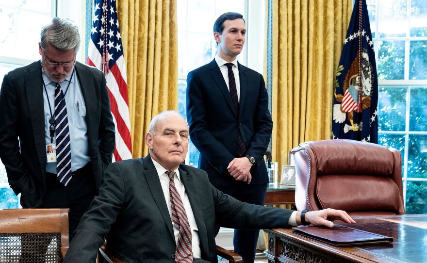 White House communications official Bill Shine (left), then-White House chief of staff John Kelly and senior adviser Jared Kushner wait in the Oval Office in December 2018. The New York Times reports that Kelly opposed Kushner's security clearance, but President Trump overruled him and others.