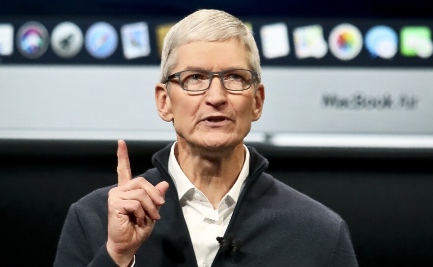 Apple CEO Tim Cook attributed slower sales in China in part to the devaluation of the yuan.