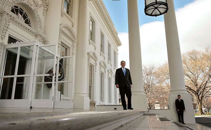 President George W. Bush waits on the North Portico for the arrival of Republican presidential nominee Sen. John McCain at the White House on March 5, 2008.
