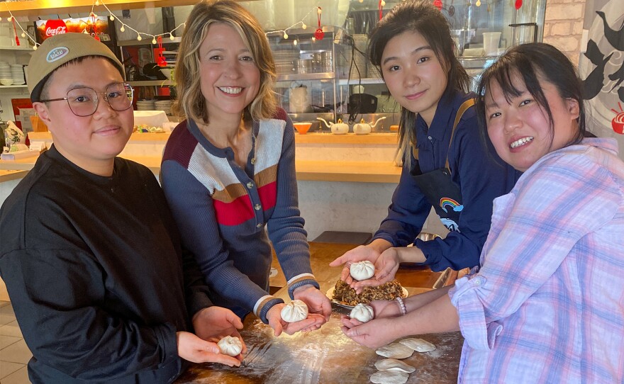 In Dover, Samantha (second from left) is taught the fine art of making authentic dumplings at Hong Asian Noodle Bar where three friends created a restaurant serving the food they grew up with in China.