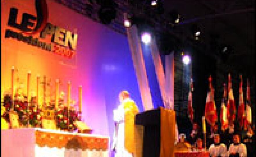 A Catholic priest celebrates mass at the National Front presidential convention near Paris.