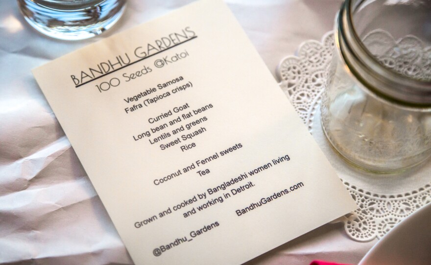 A dinner menu from a pop-up dinner that featured long beans, broad beans, squash, greens and chilies grown in Detroit by the women of Bandhu Gardens.