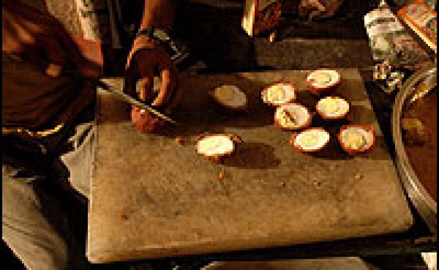 Kitchen workers in Lucknow craft eggs wrapped in minced meat for a Nawabi feast. Part of a centuries-old tradition, Nawabi cooking is heavy on cream and oil, and incorporates dozens of spices.