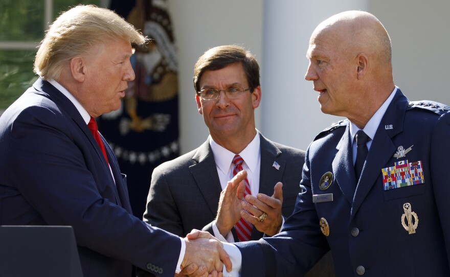 Gen. John "Jay" Raymond, with President Trump and Defense Secretary Mark Esper during a ceremony to establish the U.S. Space Command last summer.