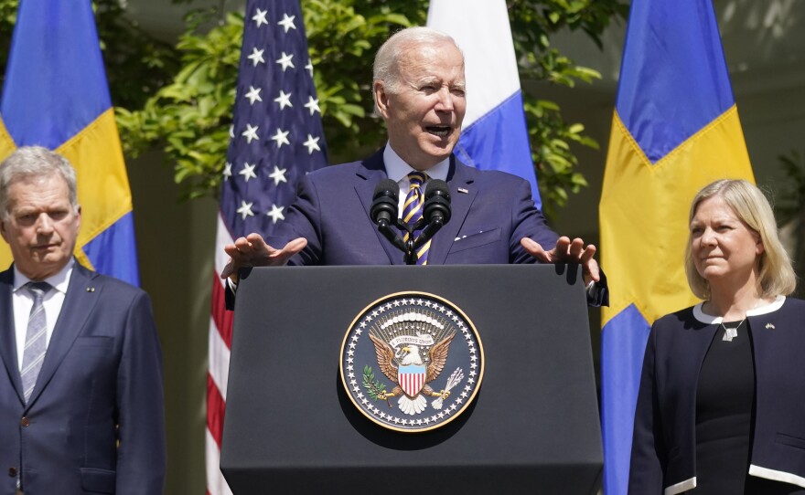 President Joe Biden, standing with Swedish Prime Minister Magdalena Andersson and Finnish President Sauli Niinisto, speaks in the Rose Garden of the White House on Thursday.