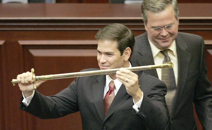 Rubio holds a sword presented to him by then Gov. Jeb Bush, during ceremonies designating Rubio as the next Florida Speaker of the House in 2005. He became the first Cuban-American to serve in that capacity.