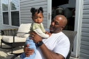 Anthony Bailey, 61, holds one of his grandchildren in this May 2025 photo.