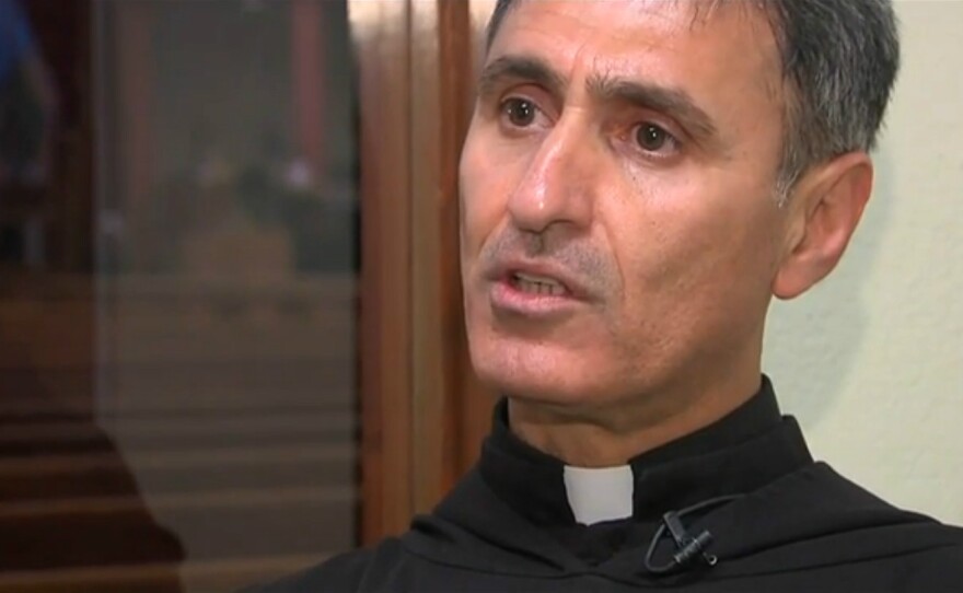 The Rev. Noel Gorgis talks to reporters on Oct. 22, 2014, at St. Peter Chaldean Catholic Cathedral in El Cajon.