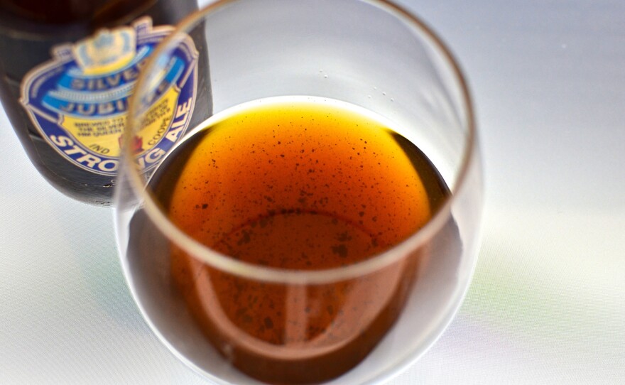 Sediment in a glass of 1977 Ind Coope Strong Ale. Proteins in very old beers can coagulate into chunks at the bottom of the bottle, Patrick Dawson explains in Vintage Beer.