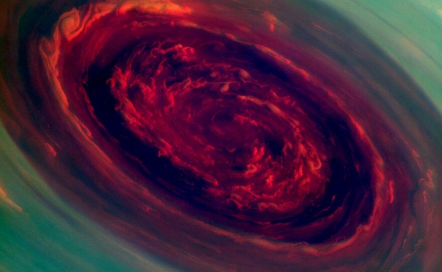 A mammoth spinning vortex is seen on Saturn, in this "false-color" photograph released by NASA Monday. The image was captured by the Cassini spacecraft. A related image, presenting what a human eye would see, is farther down this page.