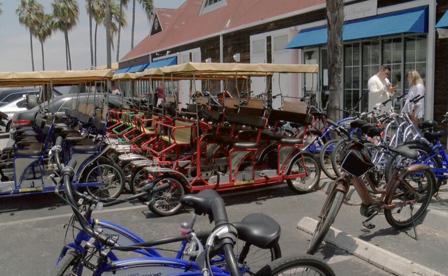 Surreys are lined up outside Howard's Bicycles and Beyond in Coronado on July 2, 2021.