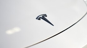 A logo for Tesla is seen on a vehicle at a Tesla facility Wednesday, April 15, 2026, in Portland, Ore.