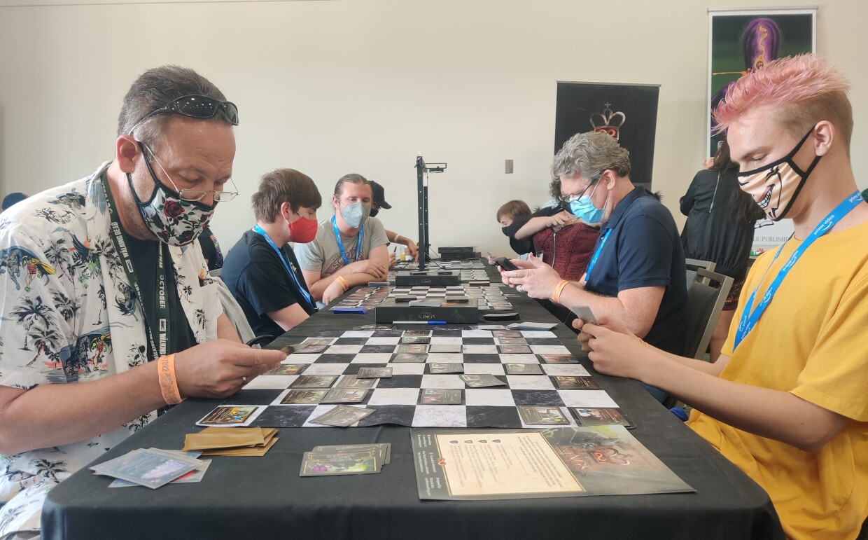 It's father (Randy Erickson) against son (Leif) at the Eternal Kings board game table, July 24, 2022.