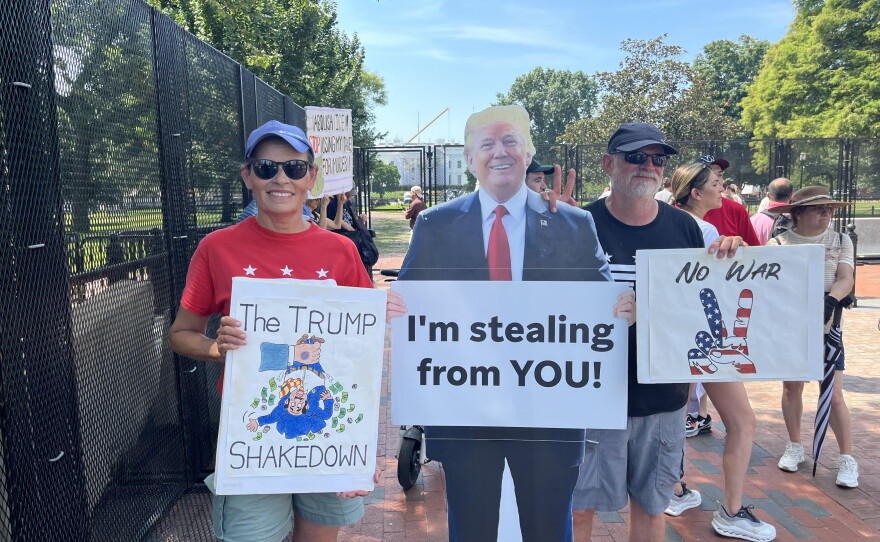 Donna Powell and her husband Don bring some of their nearly 80 handmade signs to the park several days a week. She says a permanent fence wouldn't deter them.