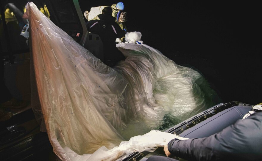 Sailors recover a high-altitude surveillance balloon on Feb. 5 off the coast of Myrtle Beach, S.C.