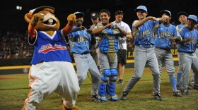 Chula Vista Park View Little League players dance with the Little League mascot, Dugout, before the game against the Southeast (Georgia) in the US semifinal at Lamade Stadium on August 27, 2009 in Williamsport, Pennsylvania. 