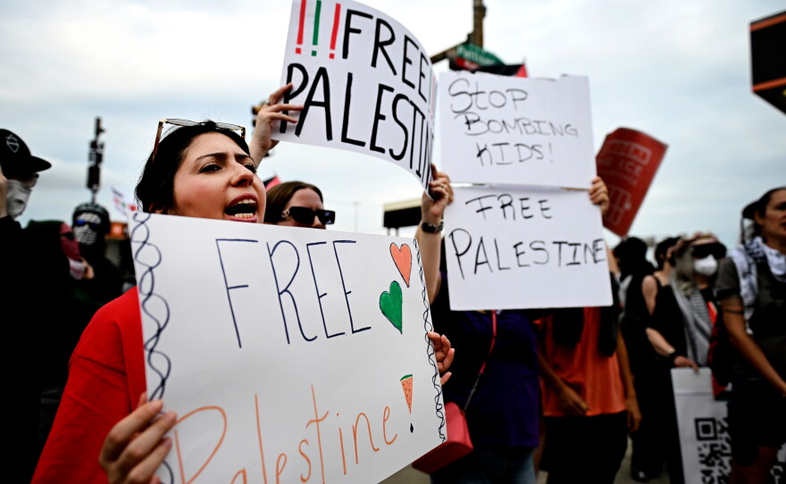 Pro-Palestinian demonstrators hold signs during a "Free Palestine" protest before an Ed Sheeran concert in Philadelphia, Saturday, Sept. 19, 2026.