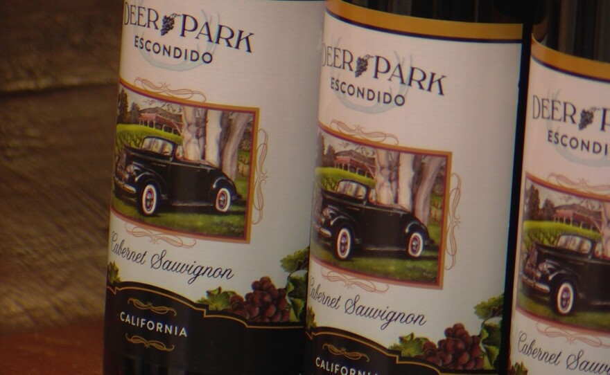 A classic car from the collection is shown on a bottle of wine at Deer Park Winery & Auto Museum on June 27, 2024.