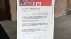 A sign posted outside of Belmont Village Senior Living in Sabre Springs explains the facility's new visitation rules in response to the coronavirus pandemic.