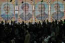 Iranian worshippers perform their Friday prayers under the portraits of the late Iranian Supreme Leader Ayatollah Ali Khamenei, second left, and top military officials who were killed during the U.S.-Israel campaign, at the Tehran University campus, in Tehran, Iran, Friday, April 24, 2026.