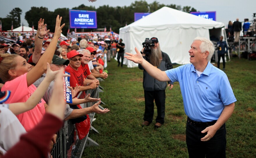 Rep. Mo Brooks greets supporters while campaigning during a "Save America" rally at York Family Farms on August 21, 2021 in Cullman, Alabama.