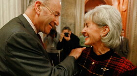 Sen. Charles Schumer (D-NY) talks with Health and Human Services Secretary Kathleen Sebelius after the Senate passed a procedural vote on health care reform Monday in Washington, D.C.