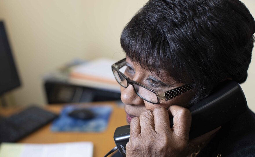 Callers and visitors to this senior center in South Los Angeles are greeted by 71-year-old Emma Allen, pictured in this undated photo, at the front desk. She says her favorite part of the job is the camaraderie with the clients.