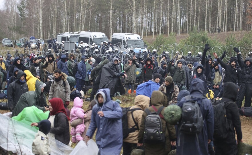 Migrants from the Middle East and elsewhere gather at the Belarus-Poland border near Grodno, Belarus, on Monday.