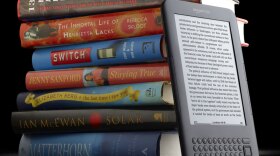 It's Kindle, and other e-readers, vs. The Book.