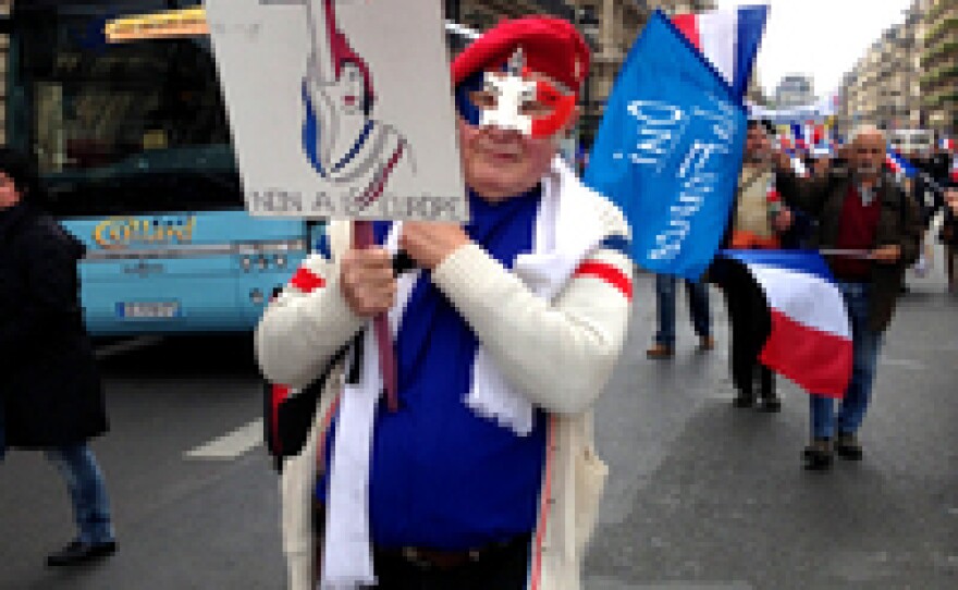 Marchers carried flags and banners during a rally for France's far right National Front party.