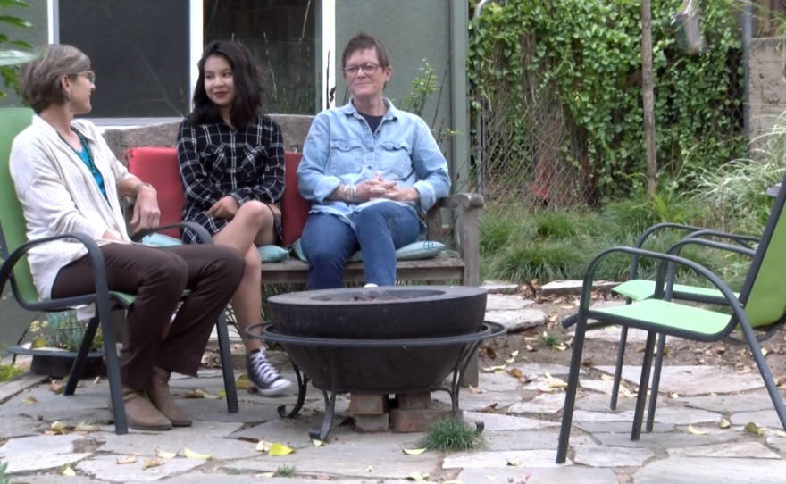 Gloria Hohenstein sits with her parents, Ellen Hohenstein and Soledad Mason, in the family's backyard, May 17, 2017.