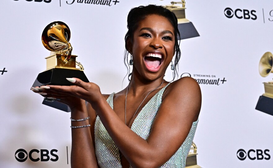 Coco Jones poses in the press room with the Grammy for best R&B performance for "ICU" during the 66th annual Grammy Awards.