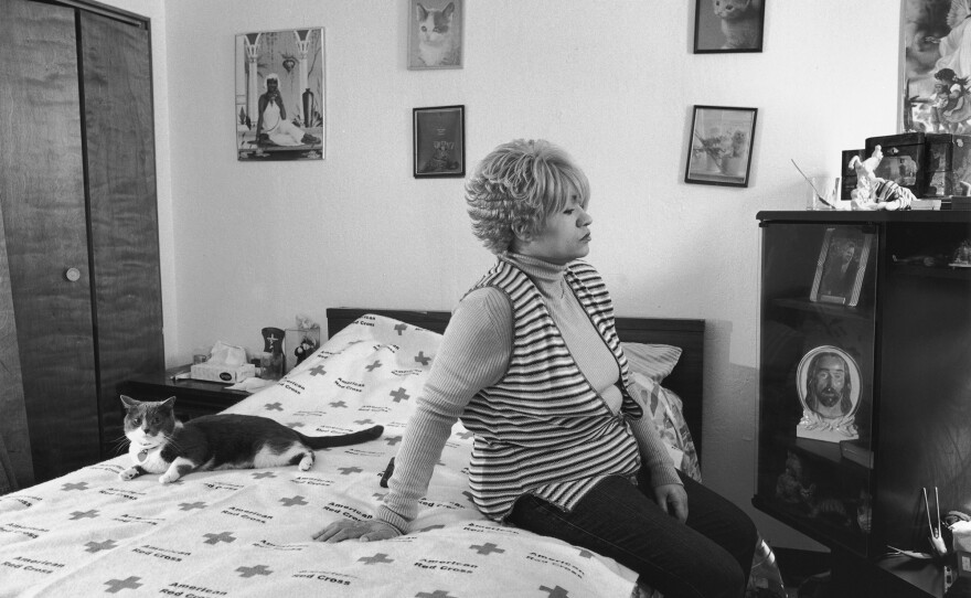 Mom and Her Cat Ziggy on American Red Cross, 2005, from The Notion of Family (Aperture, 2014)