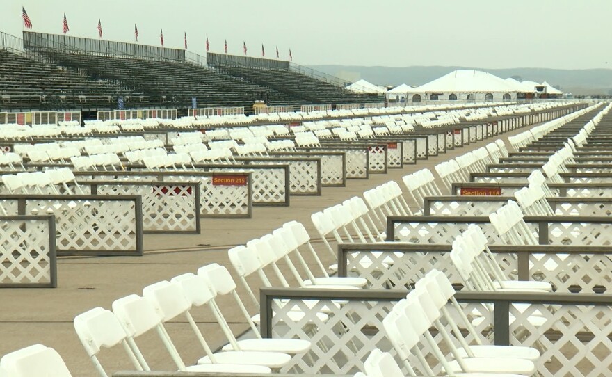 Thousands of plastic folding chairs sit in front of bleacher grandstands on the flightline at Marine Corps Air Station Miramar Sept. 26, 2024 ahead of the Miramar Air Show.