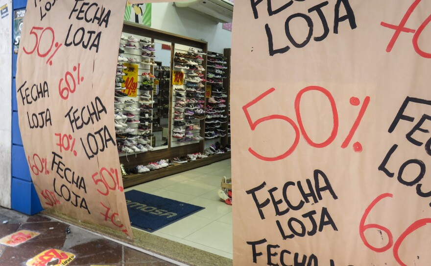 Amid Brazil's worst recession on record, shops like this one in Porto Alegre are holding final sales before they close.