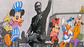 This undated photo of a celluloid animation cel shows Walt Disney riding a train alongside many of the characters he created, like Mickey Mouse, Minnie and Donald Duck.