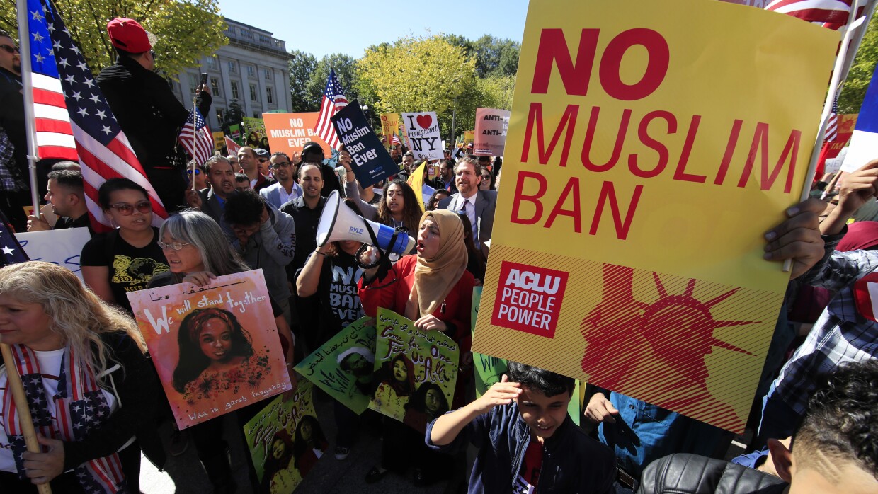 In this Oct. 18, 2017, file photo, protesters gather at a rally in Washington. The Supreme Court is allowing the Trump administration to fully enforce a ban on travel to the United States by residents of six mostly Muslim countries.