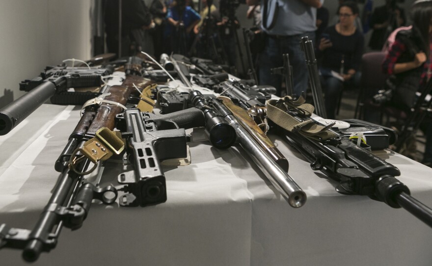 Firearms seized during a sweep by the Los Angeles Police Department using the California's Armed Prohibited Persons System initiative. The program uses a database to identify gun owners who are no longer allowed to possess a firearm.