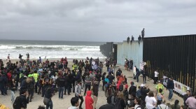 A crowd gathers on the beach in Playas de Tijuana, April 29, 2018.