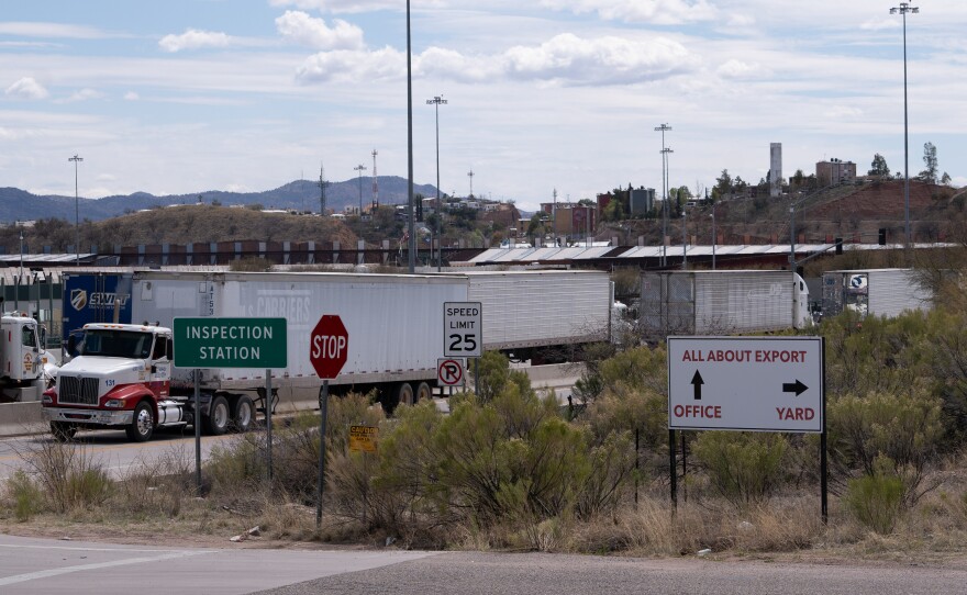 Trucks idle in traffic at the Nogales port of entry.