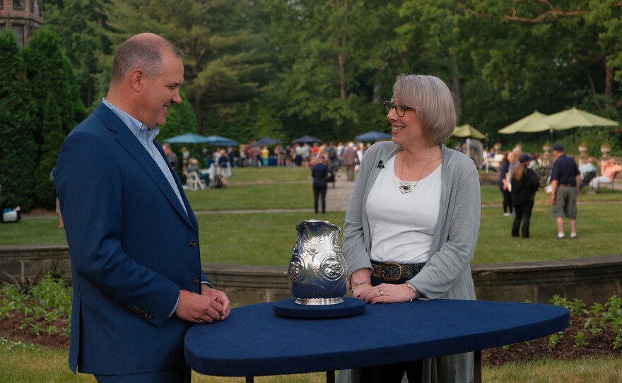 Christopher Barber (left) appraises an 1880 Tiffany & Co. silver pitcher, in Akron, Ohio. ANTIQUES ROADSHOW “Stan Hywet Hall & Gardens, Hour 2” premieres Monday, May 6 at 8/7C PM on PBS.