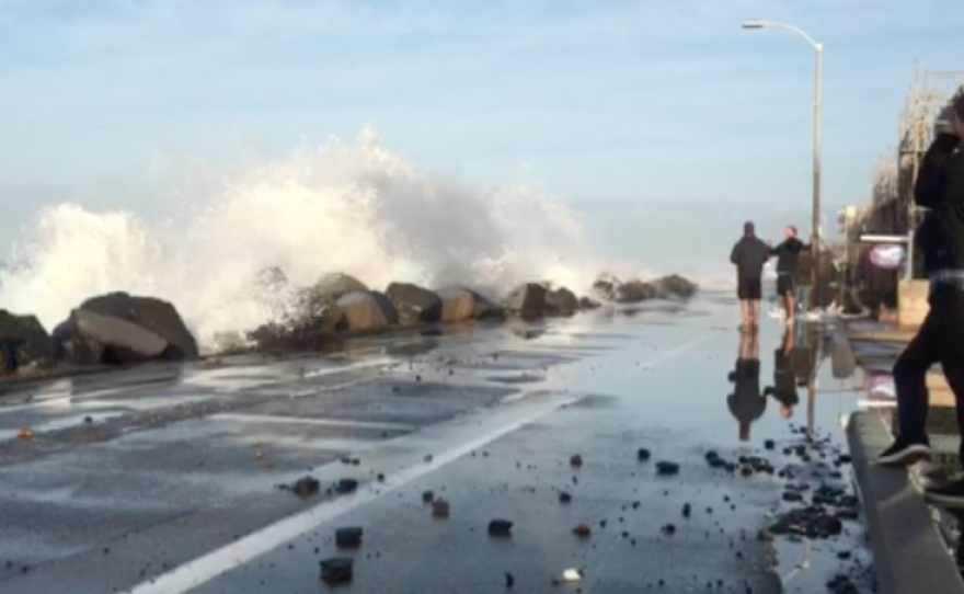 High tides crash into an Oceanside beach, Dec. 24, 2015.