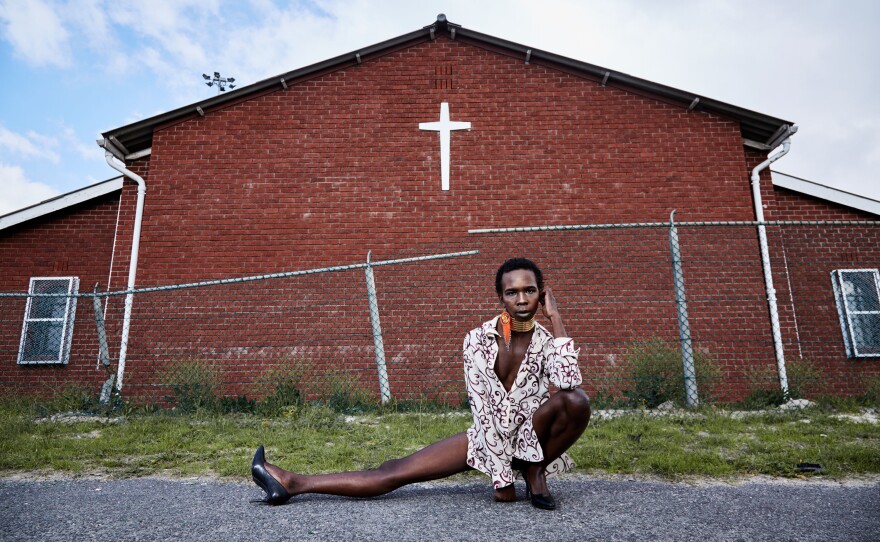 Mandisi Dolle Phika, 27, asked to be photographed by a church, an important place to her family but a place where she says she has faced anti-queer bias. At Catholic school, she remembers, "I once overheard a conversation where it was said I have a 'gay-demon.'" Now studying LGBTQI political leadership, she believes in "a colorful God" that "celebrates diversity in all its manifestations."
