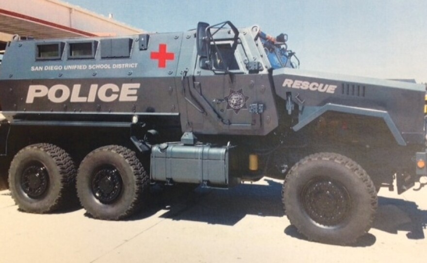 The school district has released two renderings of what the MRAP might look like after its tan military color is painted over. In one version, it's police blue; another depicts it as more of an ambulance, white with a red cross.